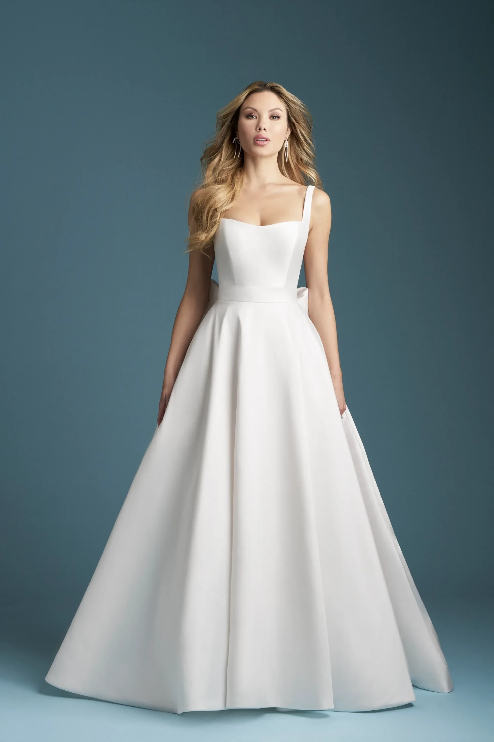 Model wearing a white Allure gown